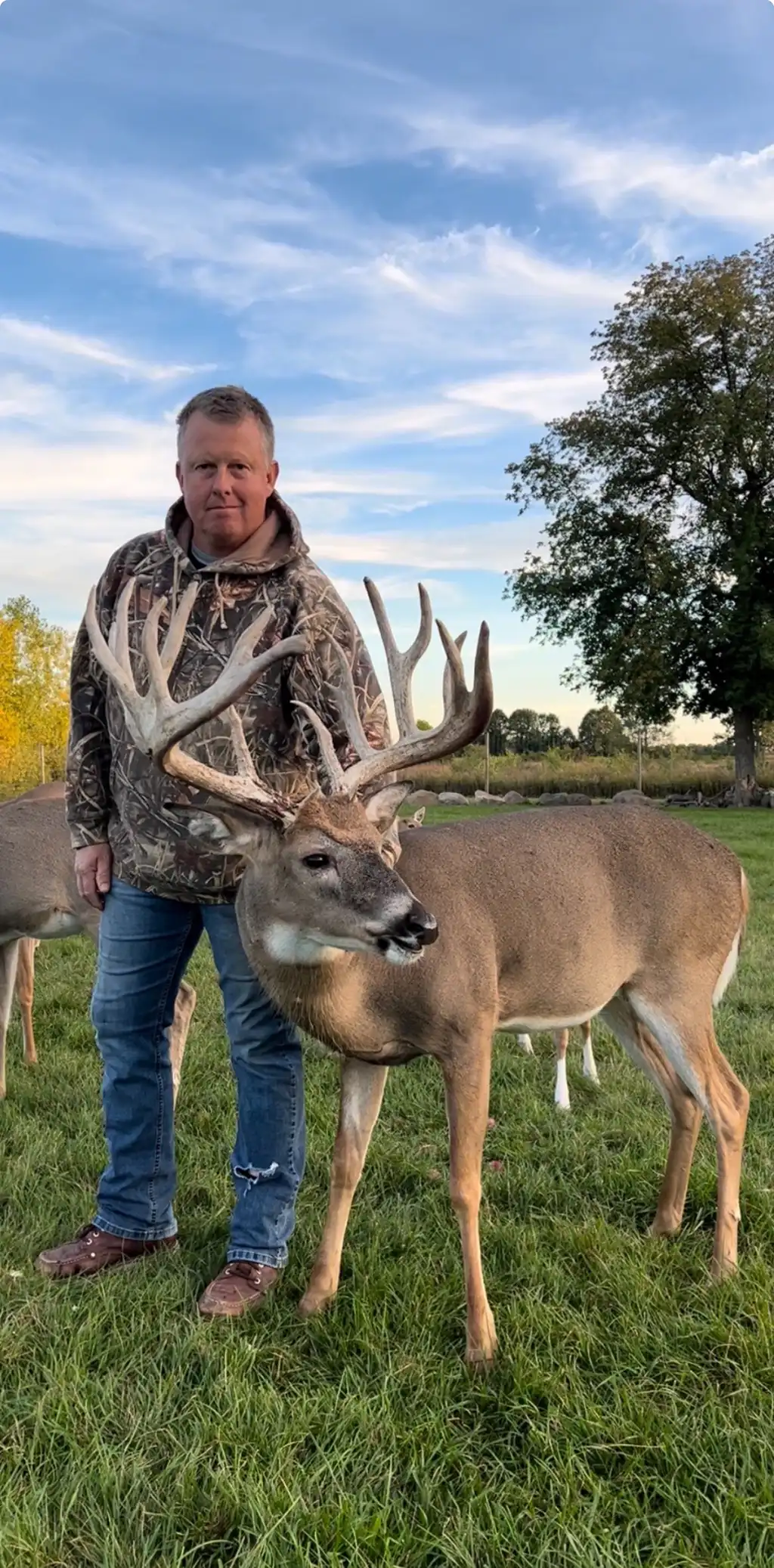 Owner pposing with a buck